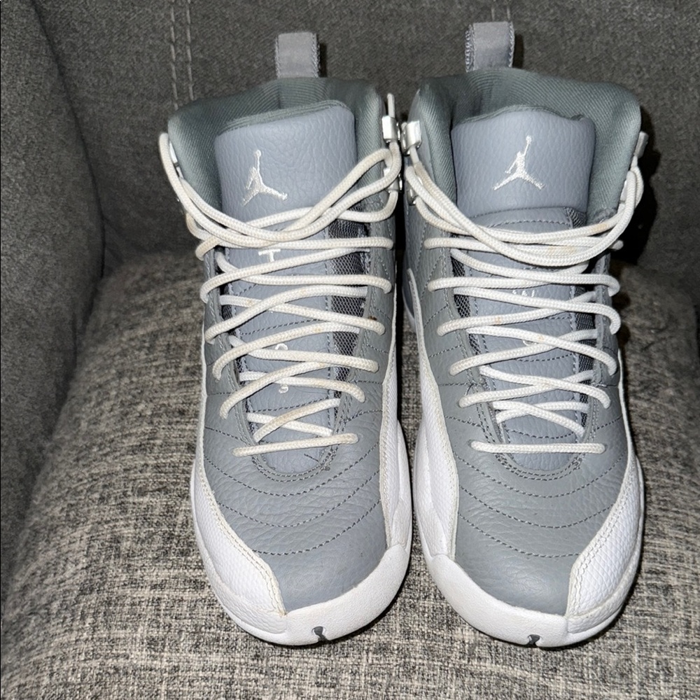 Gray and white Jordan 12’s